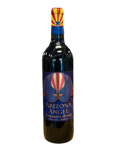 Dark glass wine bottle with front label in blue, copper and red with hints of the Arizona flag