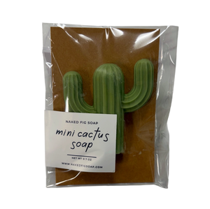 Green saguaro cactus soap on brown background wrapped in clear plastic with small white label 