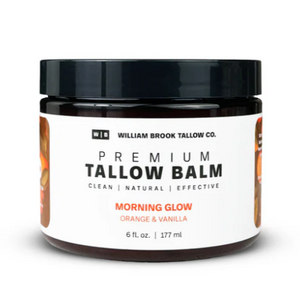 Dark plastic round jar with front label in white and orange with black and orange lettering