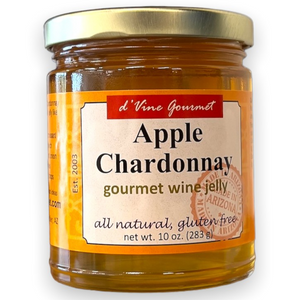 Round glass jar with gold lid containing amber colored jelly.