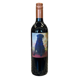 dark bottle of wine with a photo of a black lab on the label