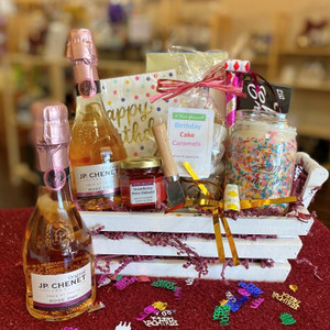White wood basket displaying all contents of gift basket