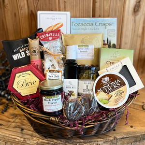 Gift contents displayed in a dark wood, wicker basket. Complete list of gift contents are listed in the product description. Gift contents displayed in a dark wood, wicker basket. Complete list of gift contents are listed in the product description.