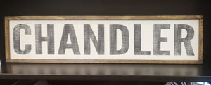 Rectangular wood sign in white and lettering in rustic black