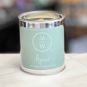 Round tin container with lid and light blue label