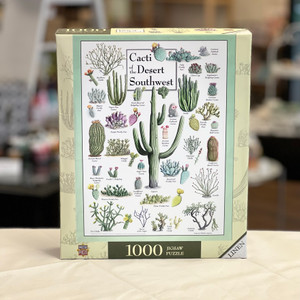 Rectangular box with image of completed puzzle with many varieties of cacti