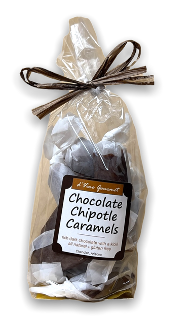 Plastic bag filled with brown caramels and tied with brown ribbon.