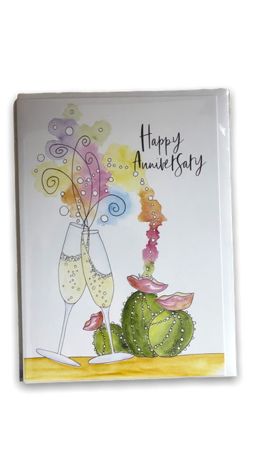 Front of white greeting card with drawing of champagne flutes and a green cactus
