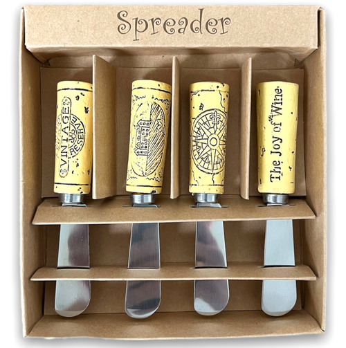 Four spreaders with different cork shaped and designed handles in a light brown gift box.