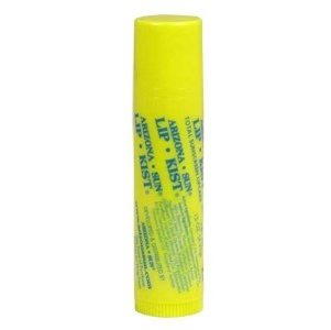 Yellow lip balm tube with green lettering.