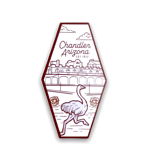 Oblong sticker in white outlined and image of downtown Chandler, Arizona and an ostrich in shades of brown