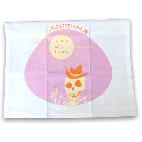 white towel with image of the sun and a skeleton on a pink background 