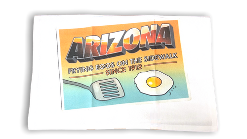 white kitchen towel with image of a fried egg and spatula with Arizona printed along the top