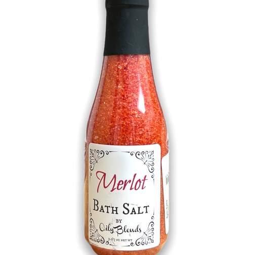 wine bottle shaped plastic bottle containing red bath salts with a white front label
