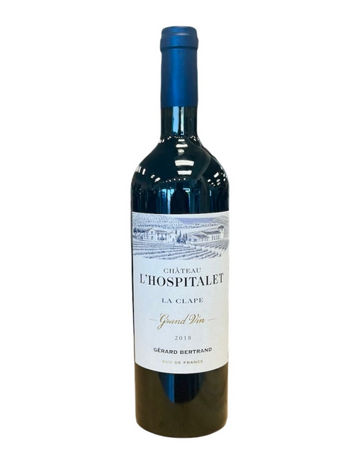Dark glass wine bottle with a white and blue front label