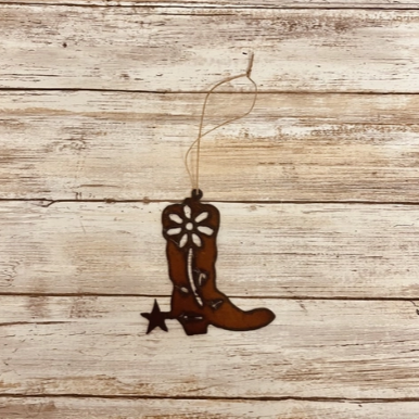 Iron cutout in the shape of a cowboy boot with spur and string for hanging ornament.