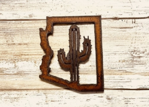 rusted steel in the outline shape of Arizona and a saguaro cactus in the center. rusted steel in the outline shape of Arizona and a saguaro cactus in the center.
