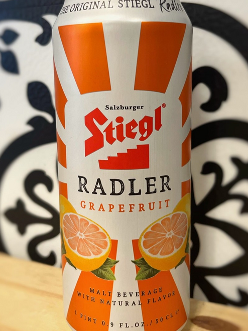 beer can with orange stripe and red lettering