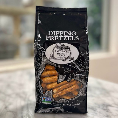 Black bag with "Dipping Pretzels" written on the top in white lettering, above the East Shore Specialty Foods logo. A clear window shows some of the pretzels inside