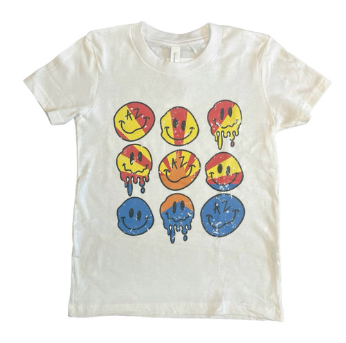 Light tan t-shirt with smiley emojis in yellow, red, and blue that appear to be melting.