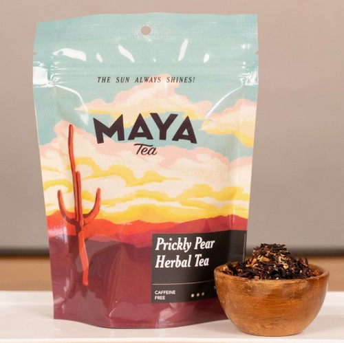Plastic resealable food pouch with a desert sunset scape and cacti with black lettering