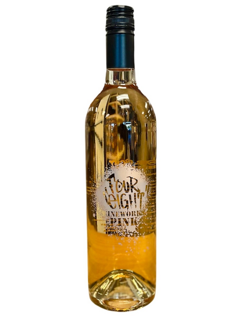 Tall clear glass wine bottle. Front label looks spray painted in white