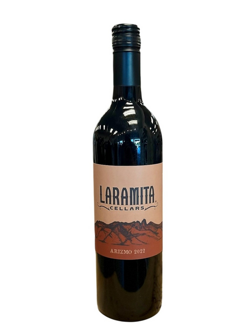 Dark glass wine bottle with dark tan front label with image of hills
