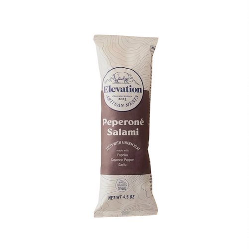 Oblong off-white paper packaging with brown front label with white lettering