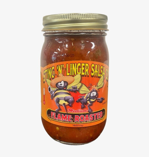 A tall cylindrical glass jar with gold lid containing red salsa; the label says “Sting N Linger Salsa” across the top in yellow font, the companies logo of two cowboy-like bee’s in the middle