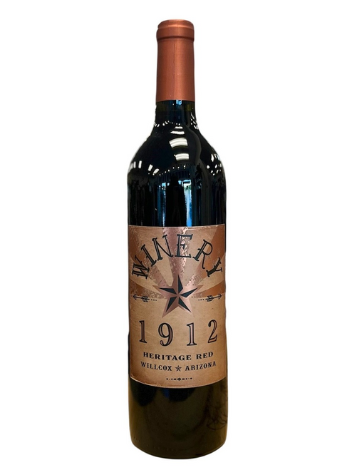 Wine bottle with Winery 1912 front label in tones of copper and black. 