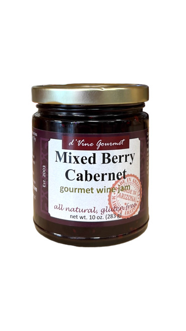 Round glass jar with gold lid containing dark red colored jelly.