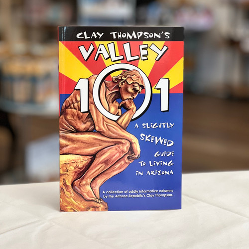 Book cover with bronze statue, blue, red and yellow in the design of the Arizona flag. Book cover with bronze statue, blue, red and yellow in the design of the Arizona flag.