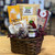 Dark brown oval wicker basket displaying contents of gift