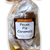 Clear cello bag containing individually wrapped caramels with square front label