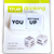 Two white die with black lettering package in a white and yellow cardboard and plastic
