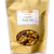 Brown zippered food bag with window containing snack mix.
