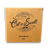 tan square box with lettering in black