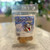 Clear plastic resealable food pouch showing contents of light brown dog treats with blue and white front label
