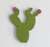 green wood magnet in the shape of a prickly pear cactus.