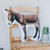 White pillow with picture of a burro