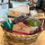 Gift basket contents displayed in a light wicker basket. All gift contents listed in the product description.