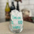 Clear stemless wine glass with the saying "I'm on cloud wine" in turquoise blue