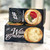 Two stacked Black long, rectangular box with image of crackers and lettering in black