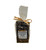 Clear cello food bag showing contents of dark chocolate bark with square white front label tied with a bow.
