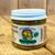 Small round clear glass jar with white lid containing green relish