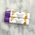 Two small tubes of lip balm with purple lids. Both tubes reading "pina colada beeswax lip balm"