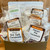 Glossy gold gift box with six packs of caramels