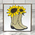 Square wood block, white background with a pair of tan cowboy boots with yellow sunflowers coming out from the top of the boots