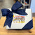Silver gift box with blue ribbon tied in a bow and a Greetings from Arizona sticker