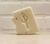 off white bar of soap in the shape of Arizona with a cut out in the shape of a saguaro cactus